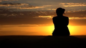 woman sitting in sunset