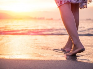silhouette-young-woman-walking-alone-beach-sunset_53476-3151